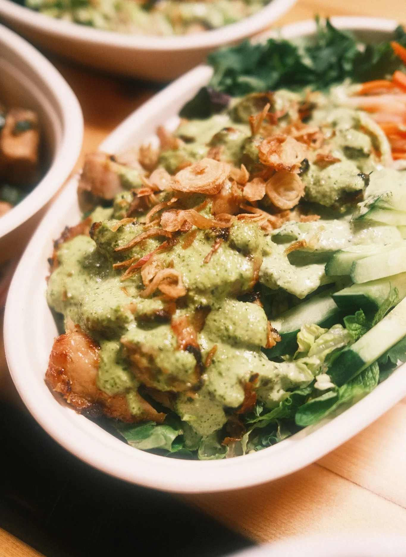 Vietnamese grilled chicken salad bowl with green sauce