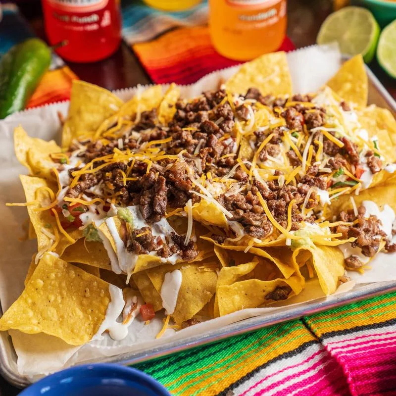 Loaded beef nachos with cheese and toppings