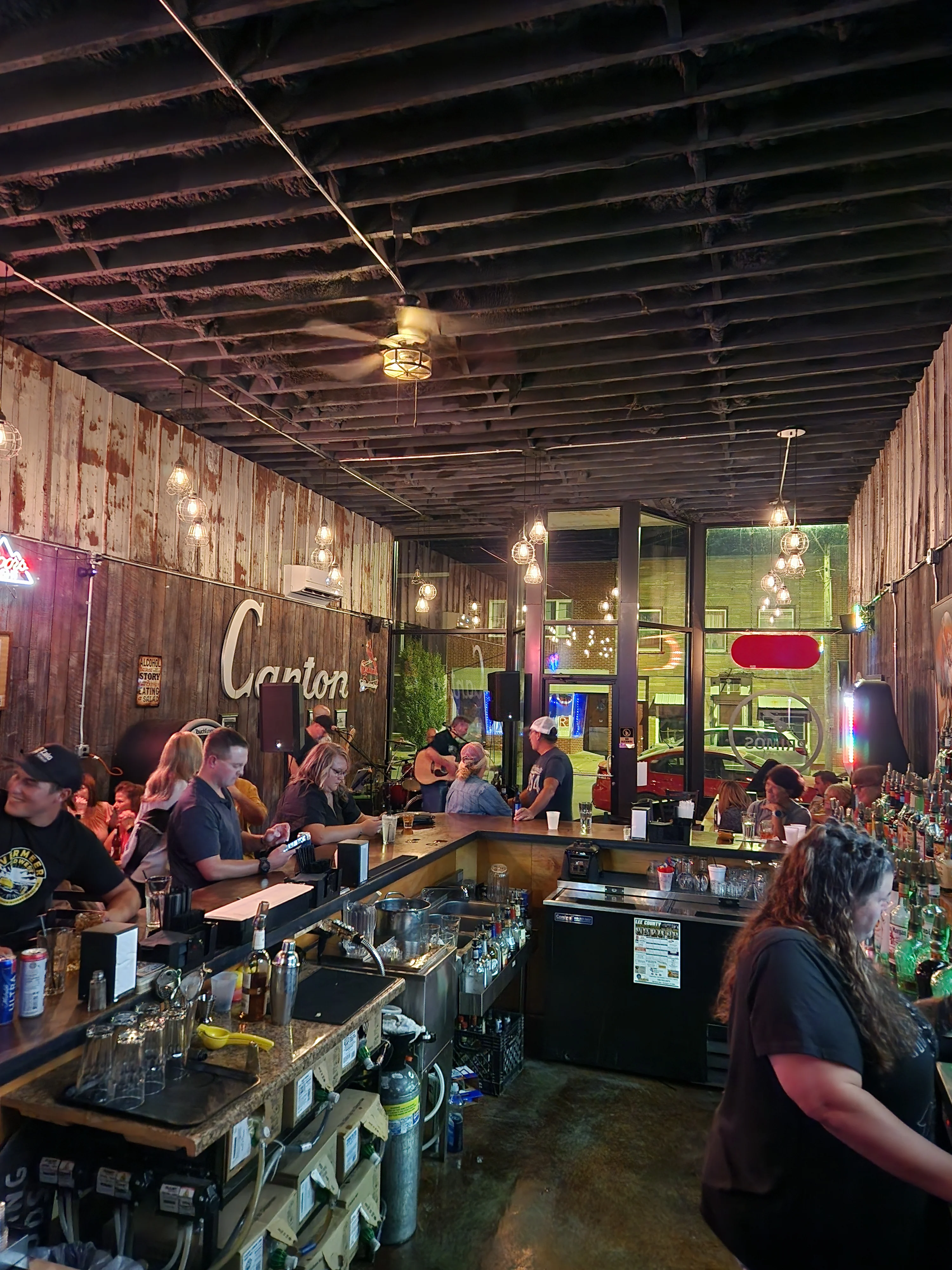 Cozy bar interior with live music and rustic decor