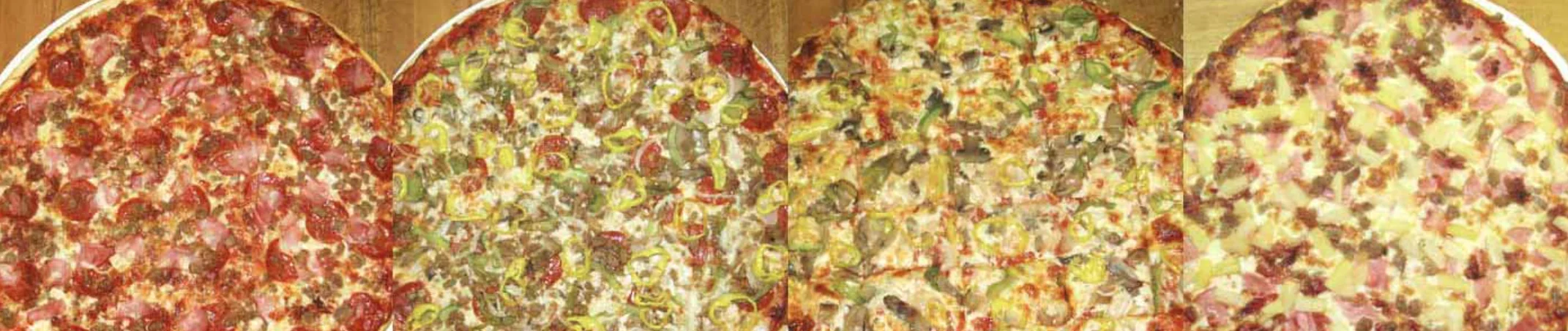 Assorted gourmet pizzas with various toppings