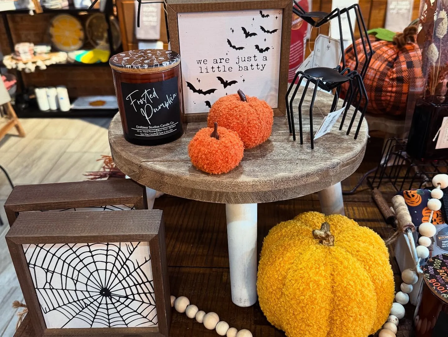 Decorative autumn display with pumpkins and candles
