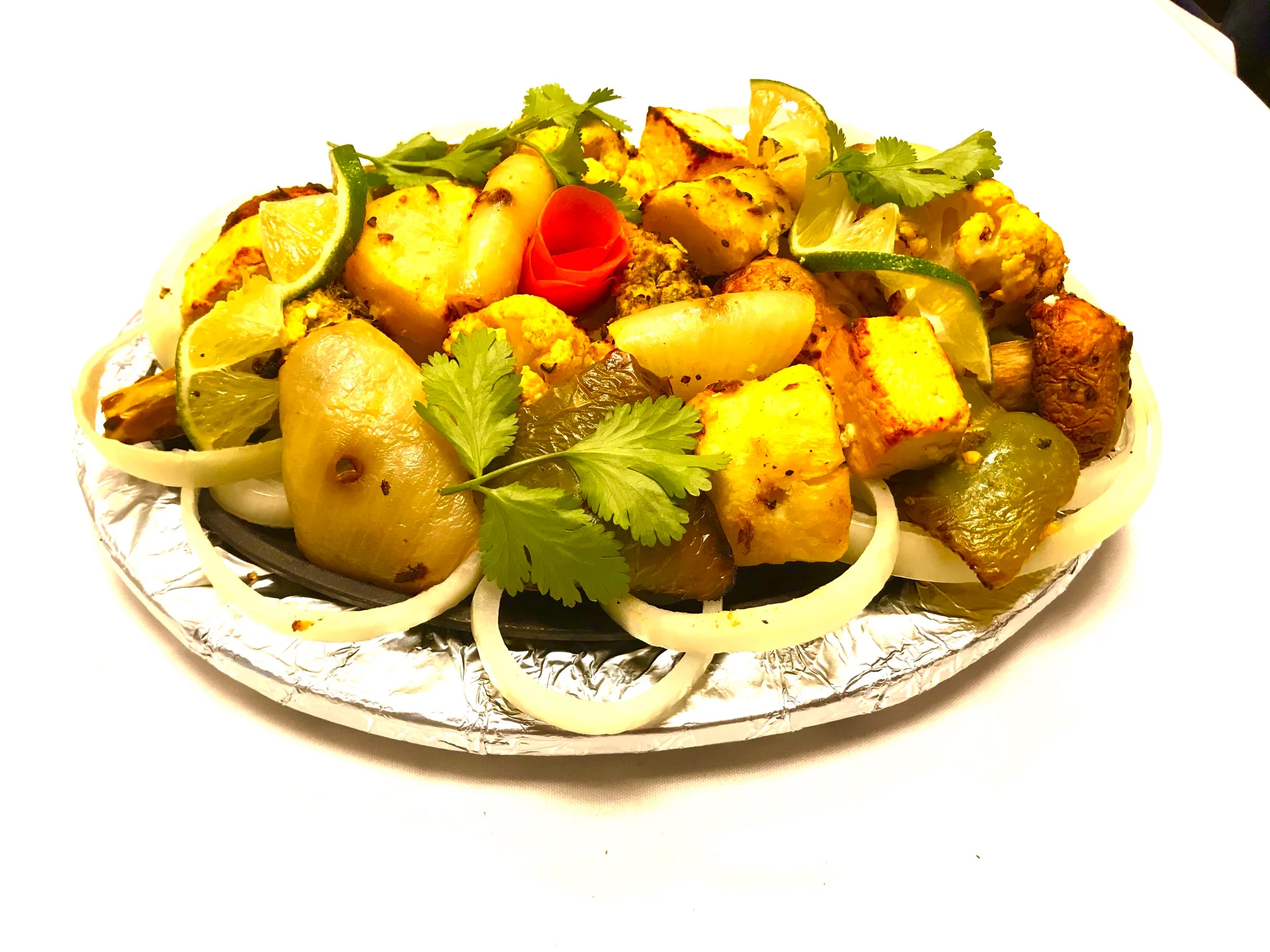 Sizzling Indian paneer tikka with vegetables