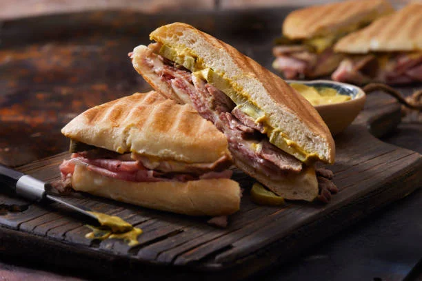 Cuban sandwich with ham and roast beef on toasted bread