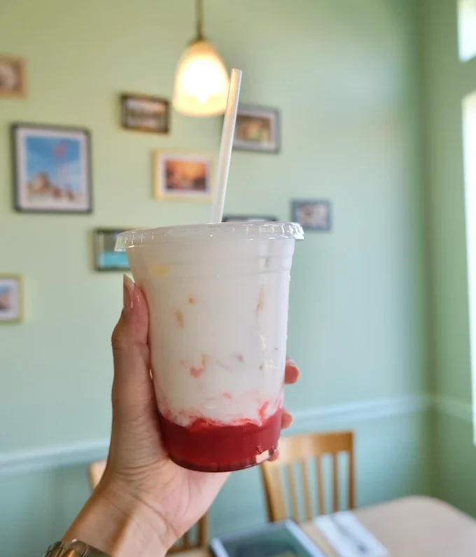 Refreshing strawberry milkshake in a clear cup
