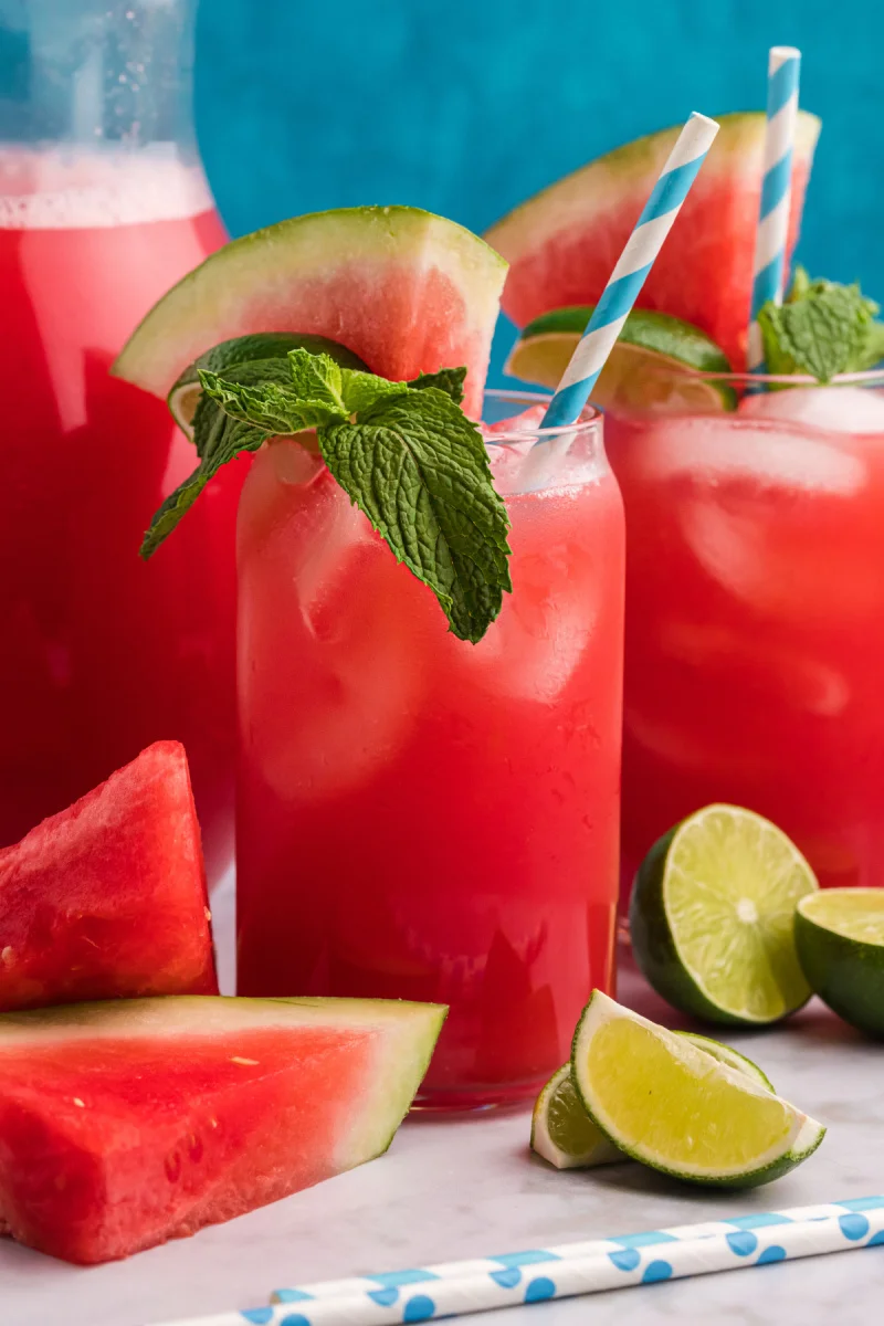 Refreshing watermelon agua fresca in a glass with ice and mint leaves.