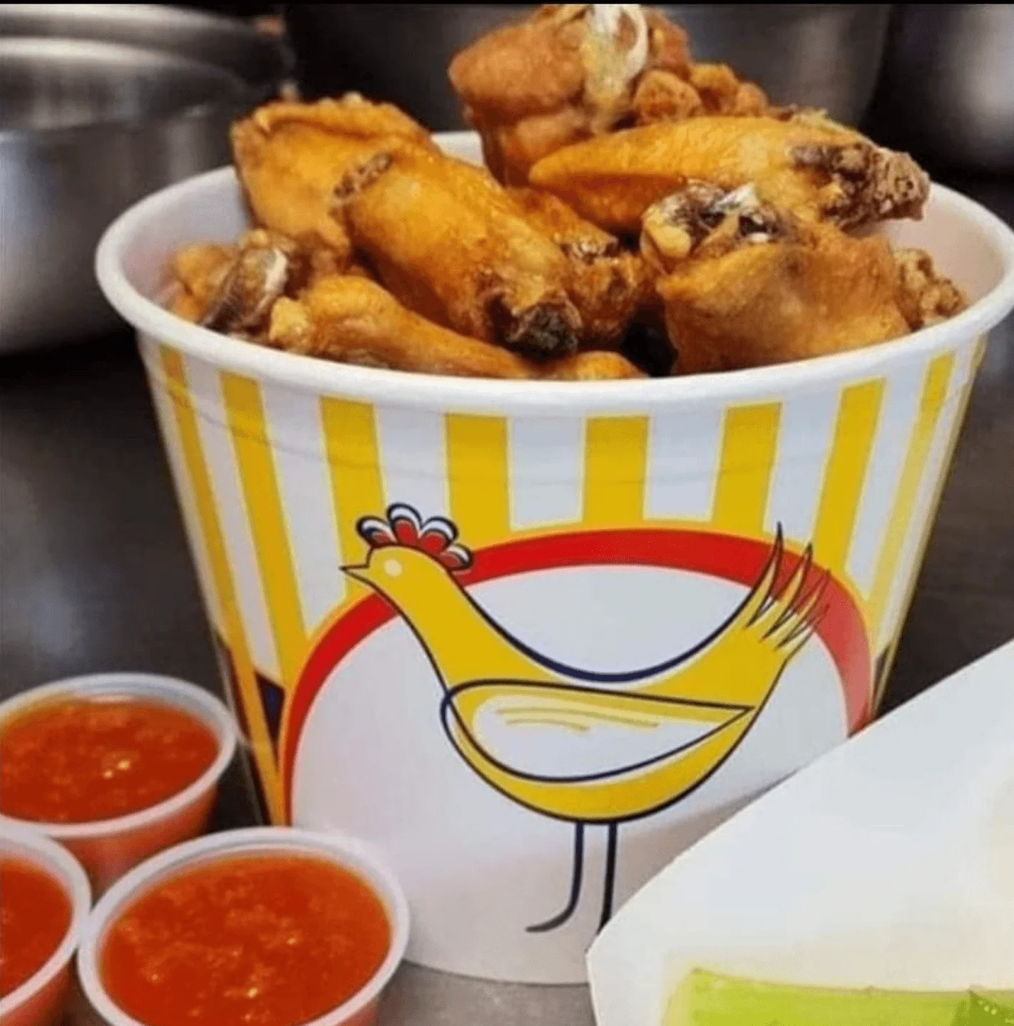 Crispy fried chicken wings served with dipping sauces
