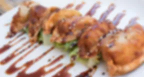 Japanese gyoza dumplings drizzled with sauce