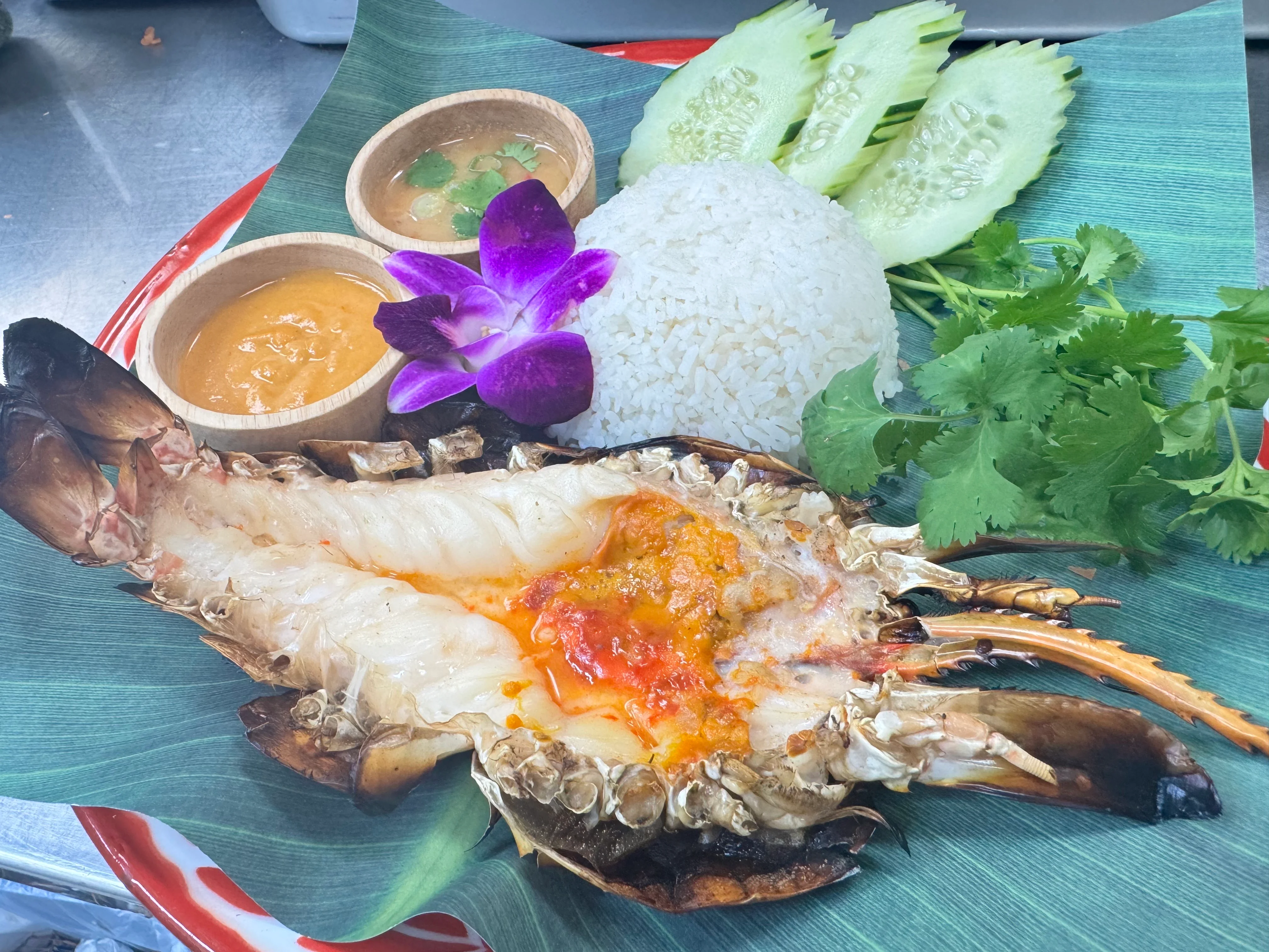 Grilled Thai lobster with rice and dipping sauces