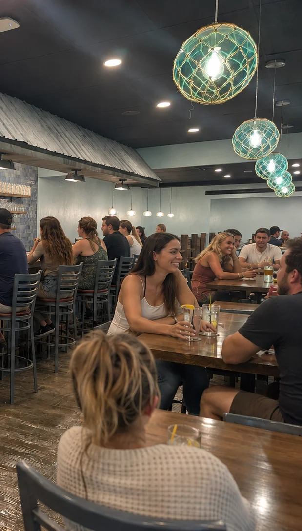 Modern bar interior with patrons enjoying drinks