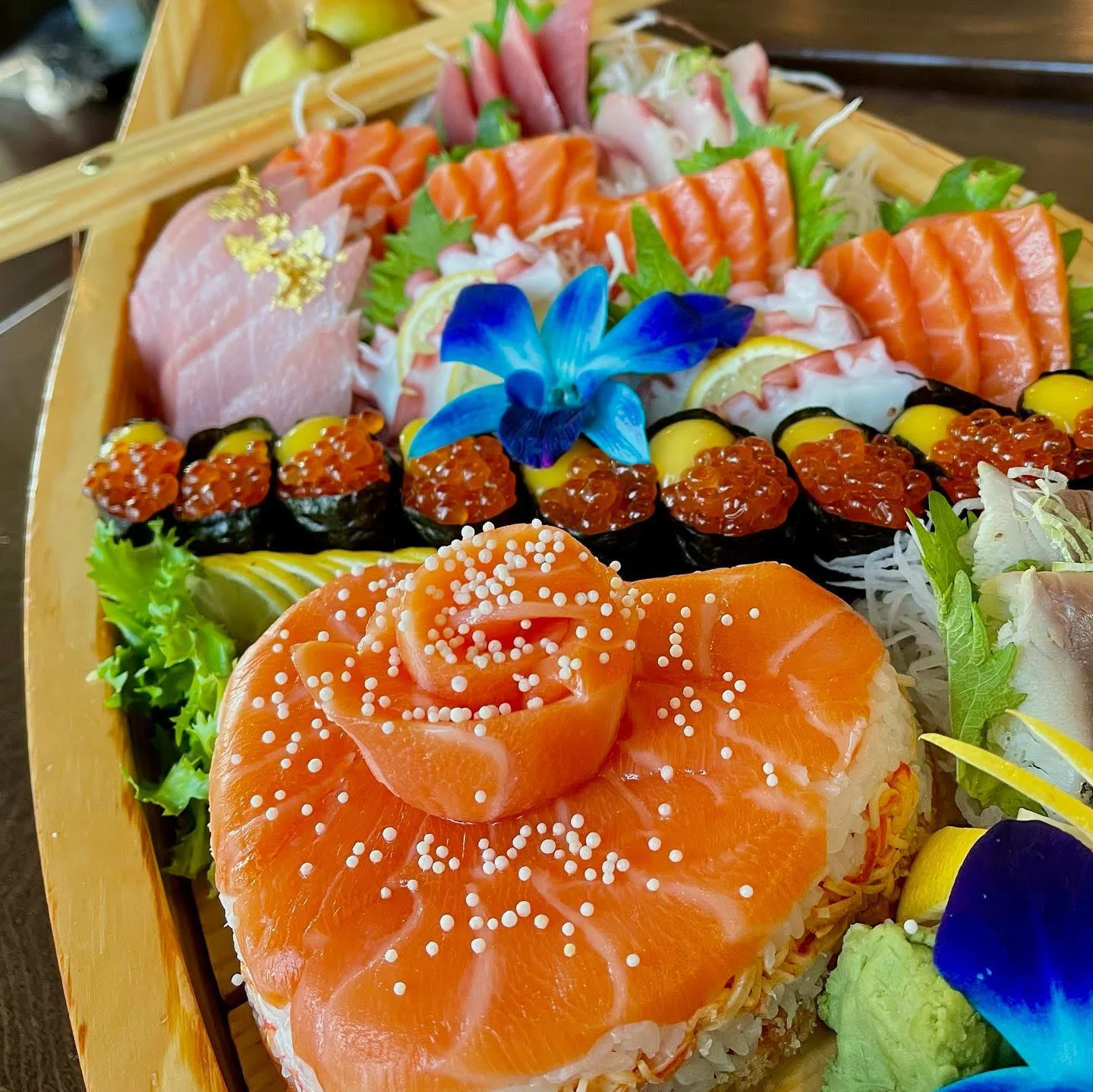 Artfully arranged Japanese sushi platter with sashimi and rolls