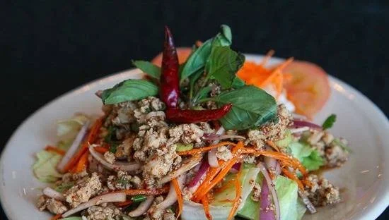 Thai larb salad with fresh herbs and vegetables