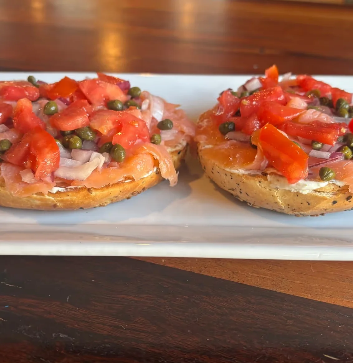 Delicious gourmet burger with fresh toppings on a wooden table
