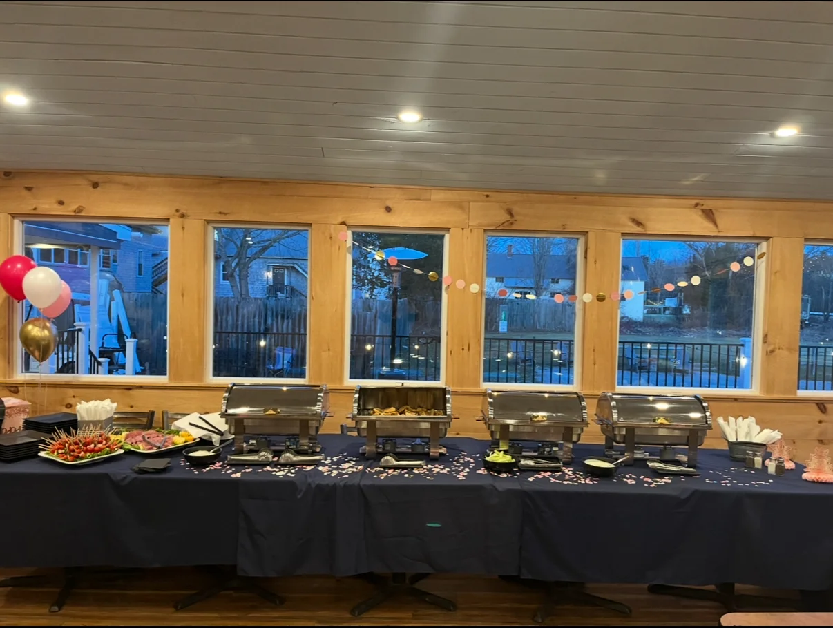 Buffet setup with assorted dishes and festive decorations