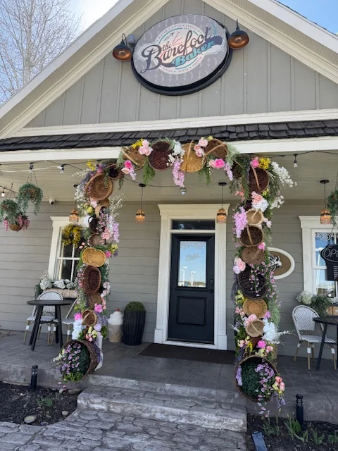 Charming restaurant entrance adorned with floral decorations