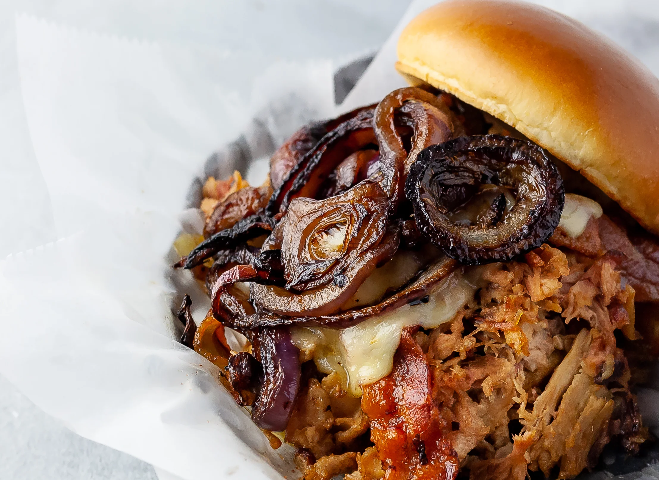 Cowboy Pulled Pork Sandwich Smoked Bacon, Grilled Onions, PepperJack