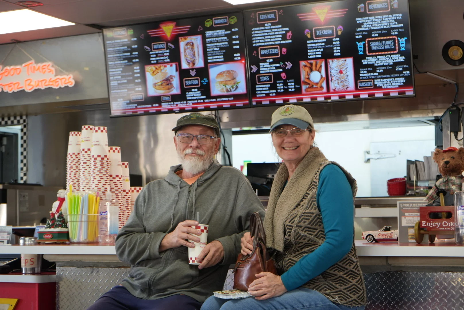 Cozy diner interior with happy customers enjoying drinks