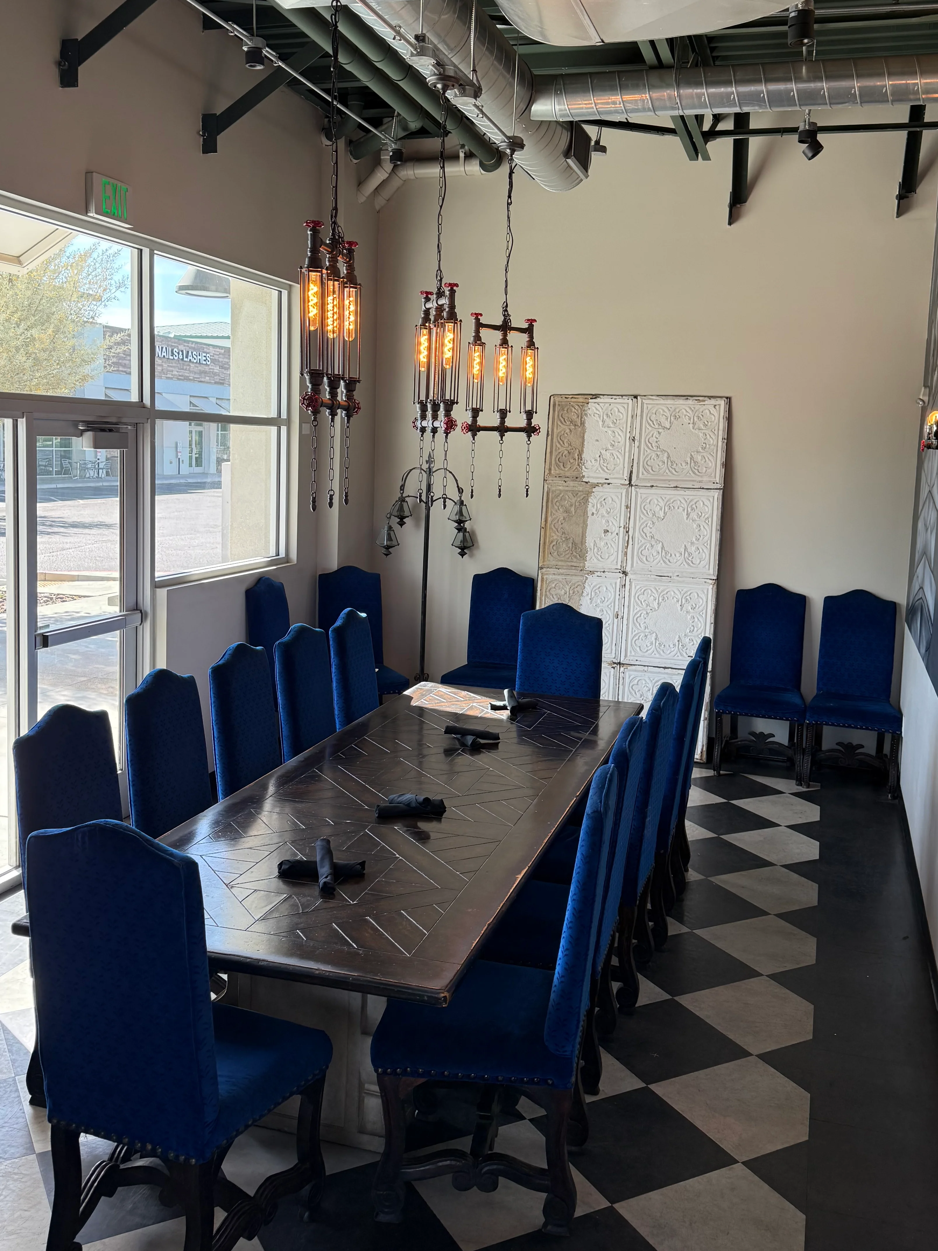 Elegant restaurant dining area with blue chairs and modern decor