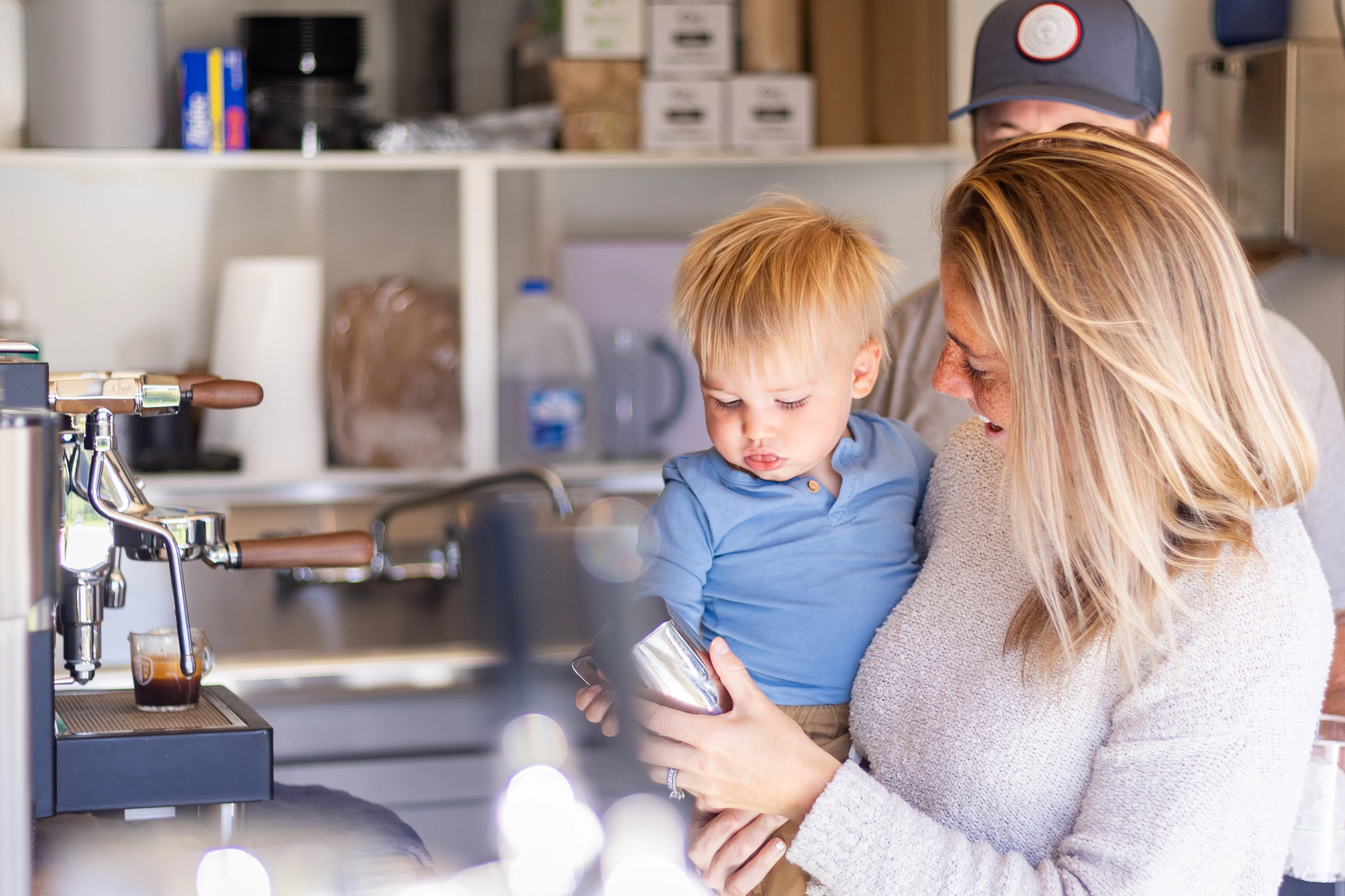 Mother and child enjoying coffee in a cozy café setting