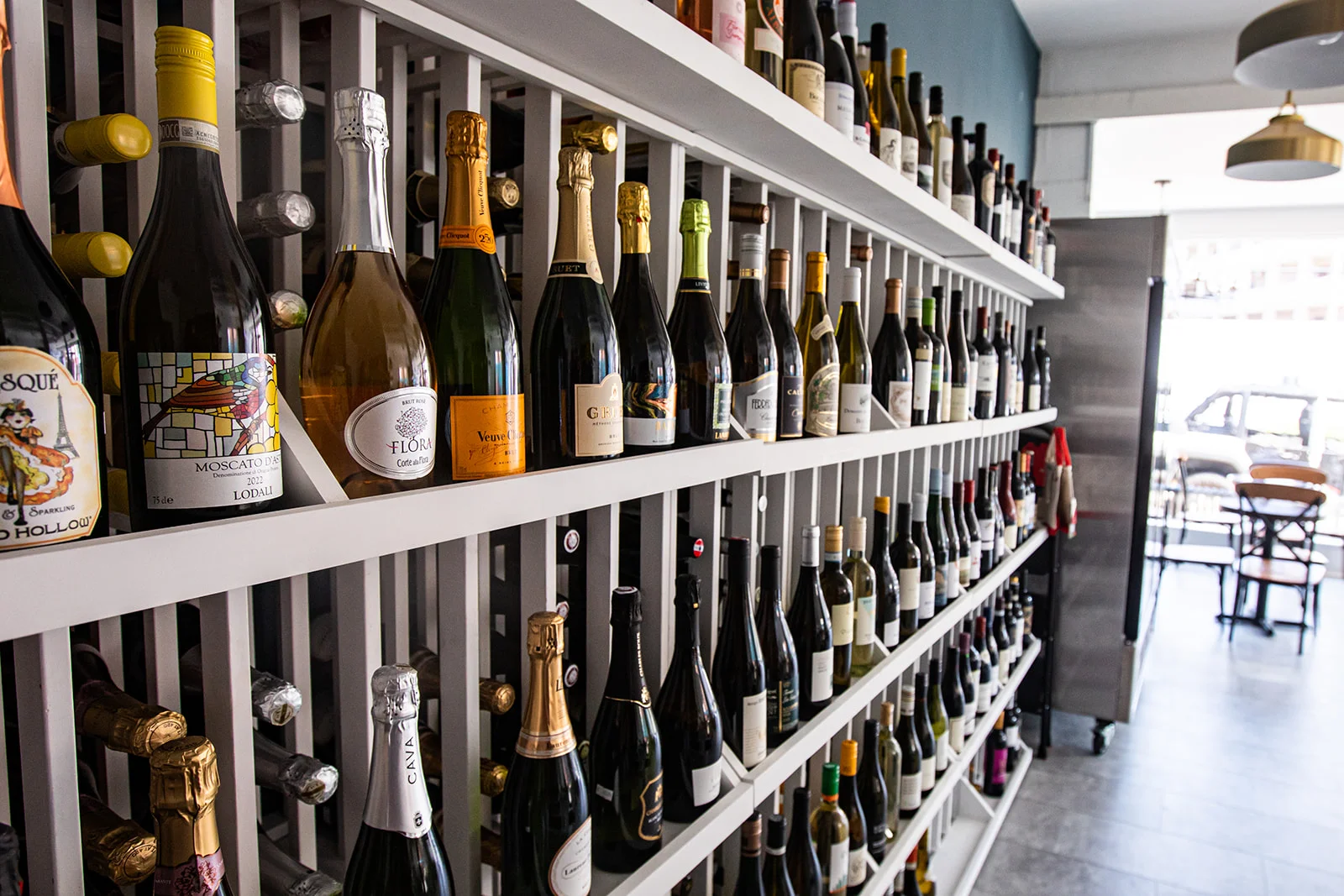 Wine display in a modern restaurant showcasing various bottles