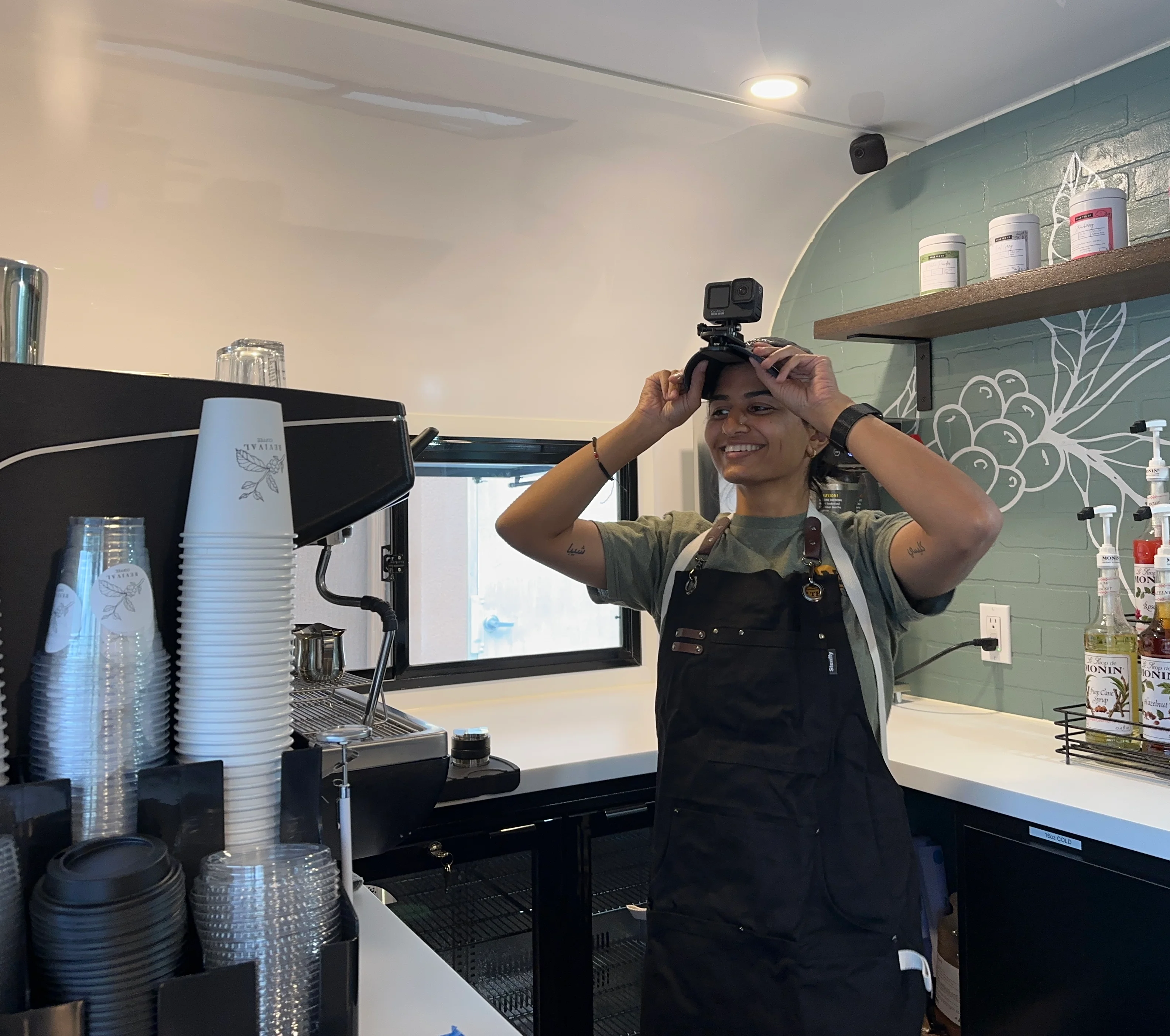 Barista smiling in a modern coffee shop