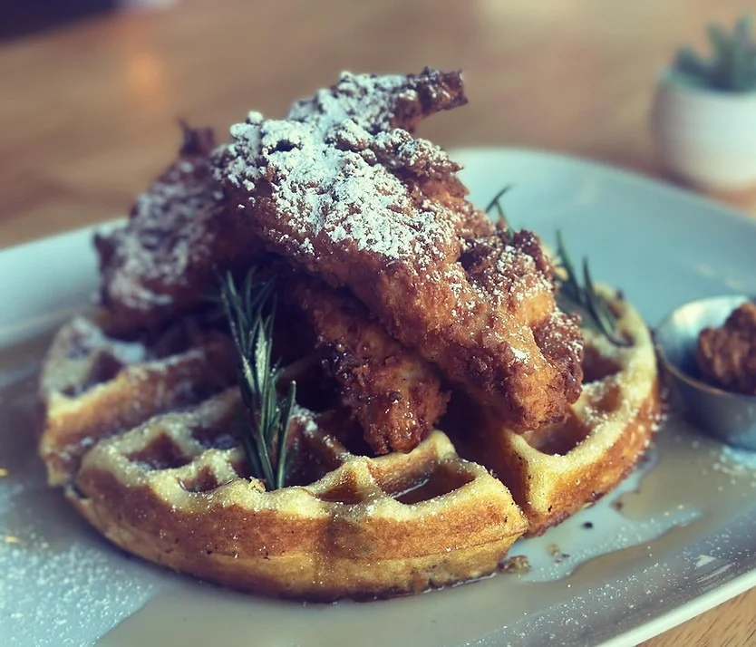Southern chicken and waffles with powdered sugar