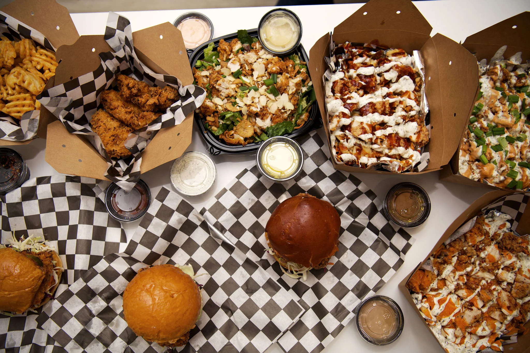 Assorted American comfort food including fried chicken and burgers