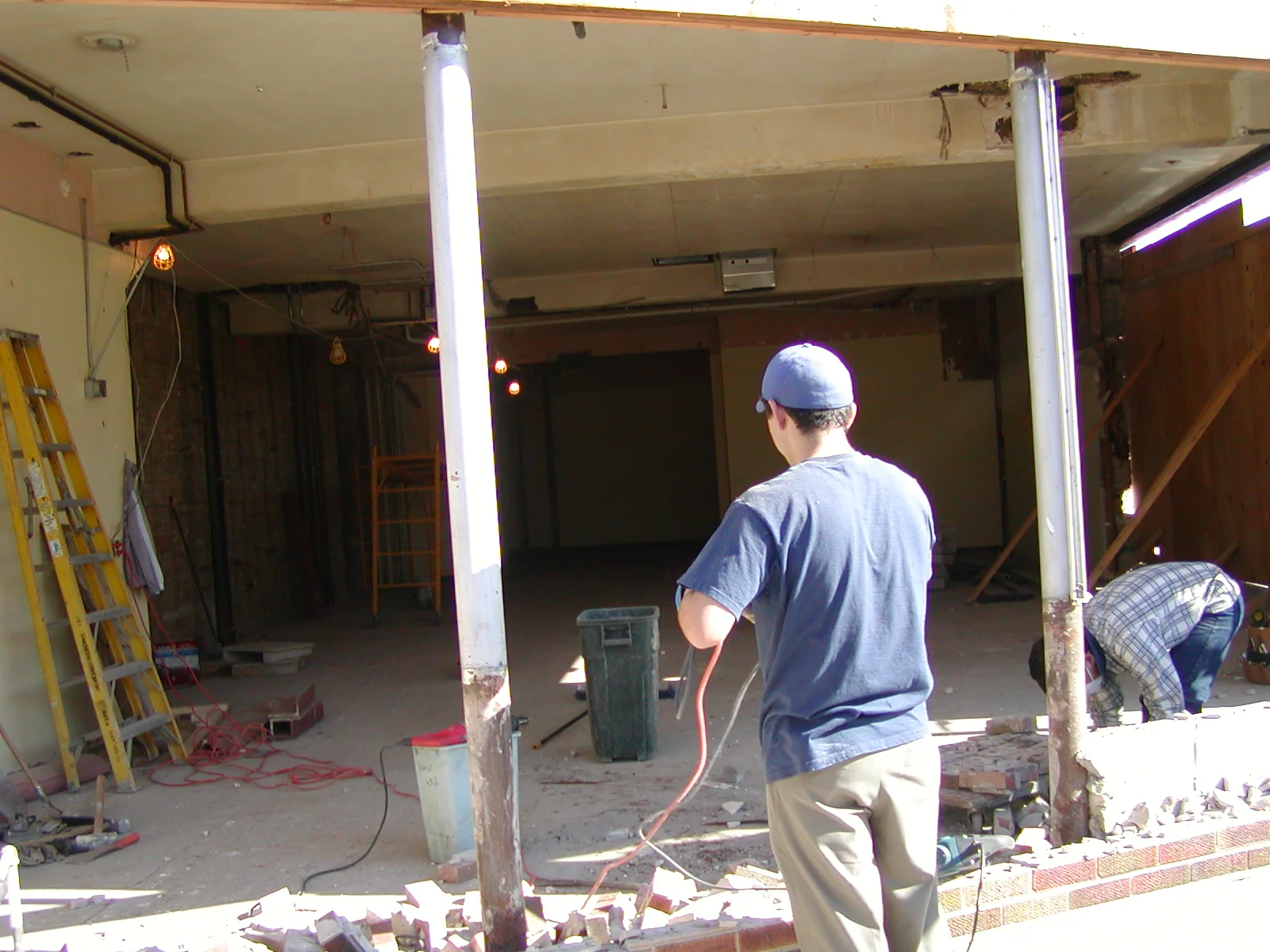 Construction site with workers renovating a restaurant interior