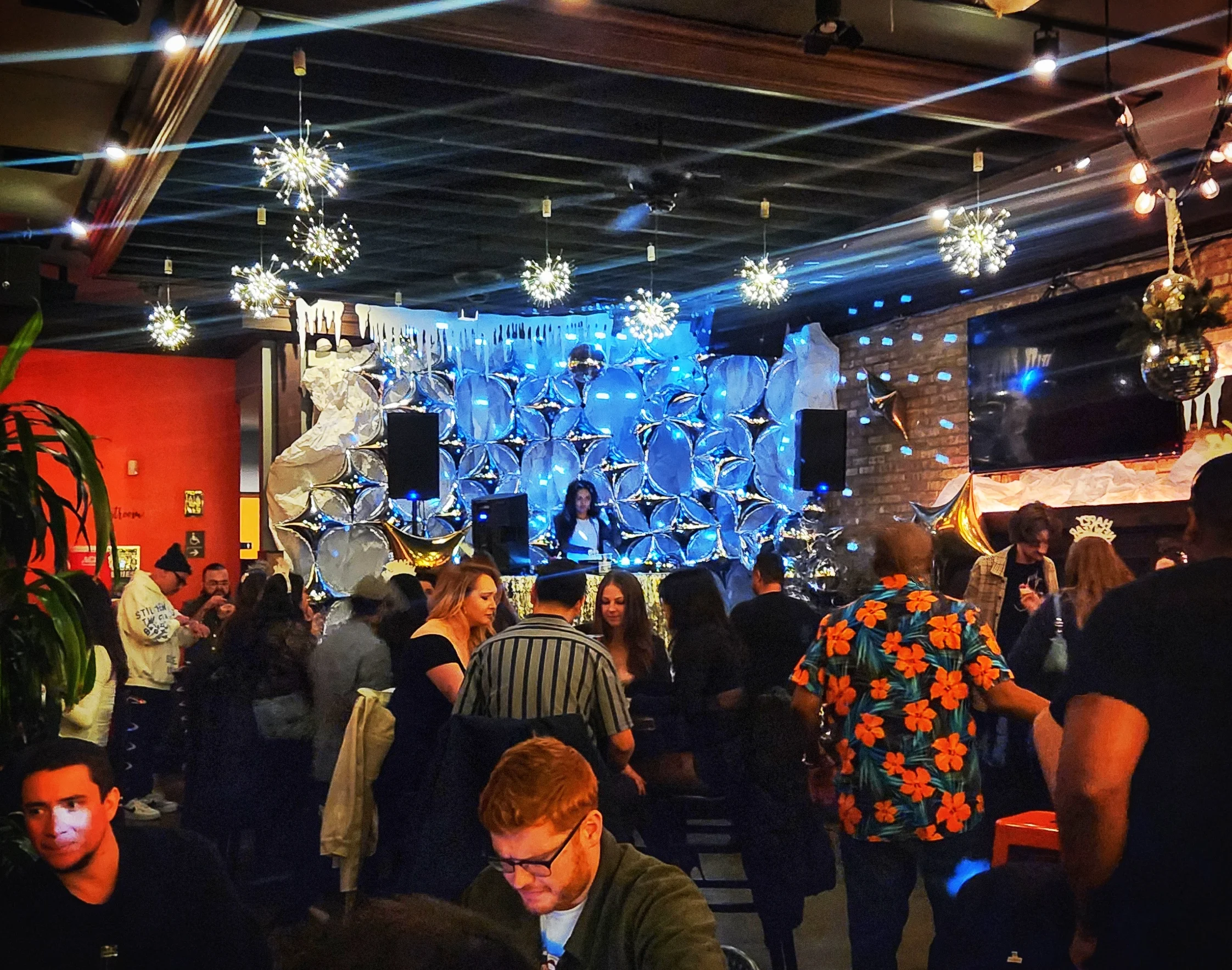 Vibrant restaurant interior with festive decor and lively crowd