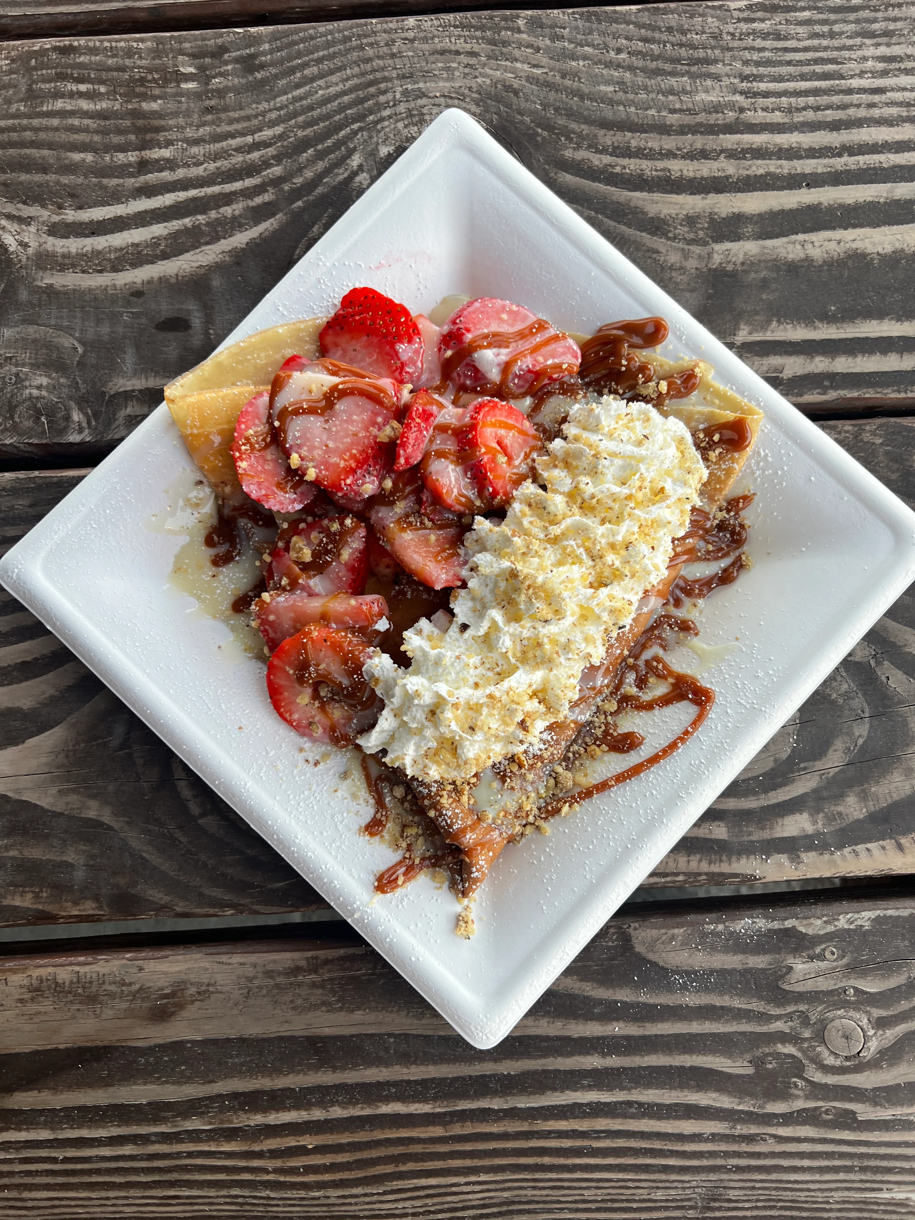 Delicious strawberry crepes with whipped cream