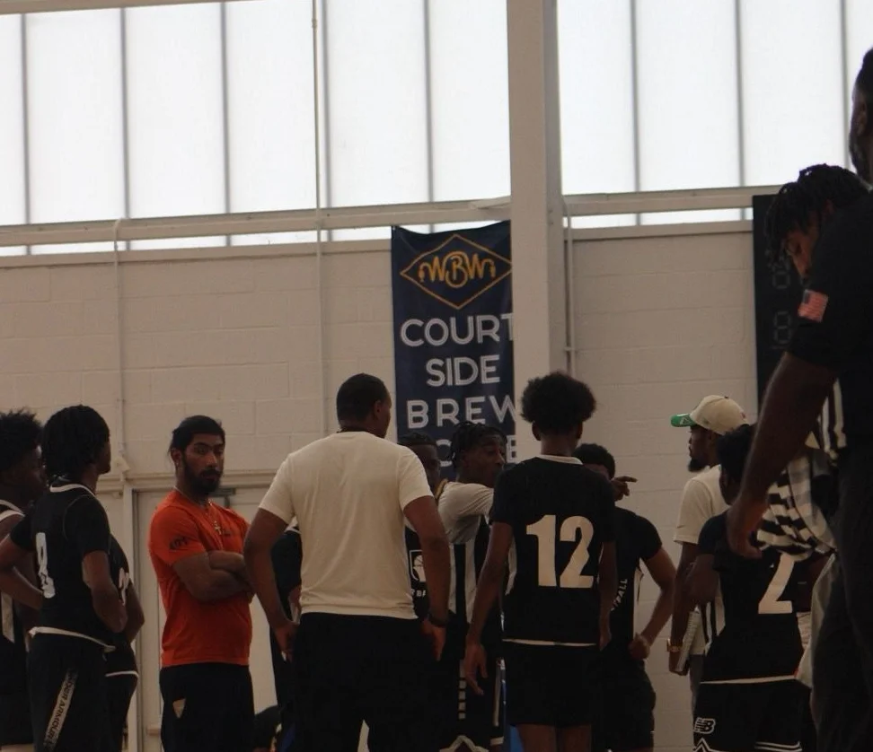 Youth basketball team huddled during a game