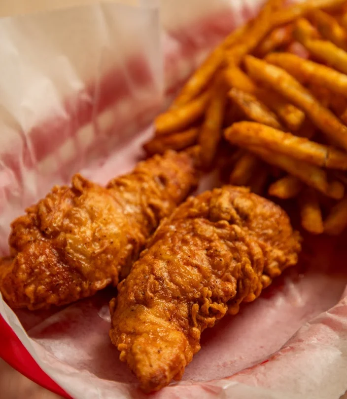 Crispy Southern fried chicken tenders with French fries