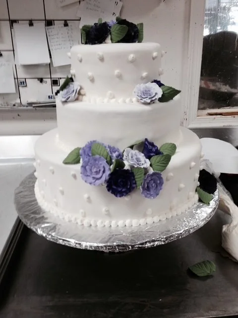 Wedding cake with lilac sugar flowers from The Kosher Pastry Oven