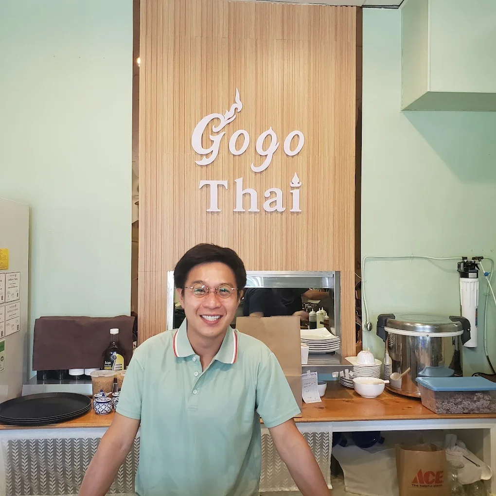 Welcoming Thai restaurant interior with friendly staff