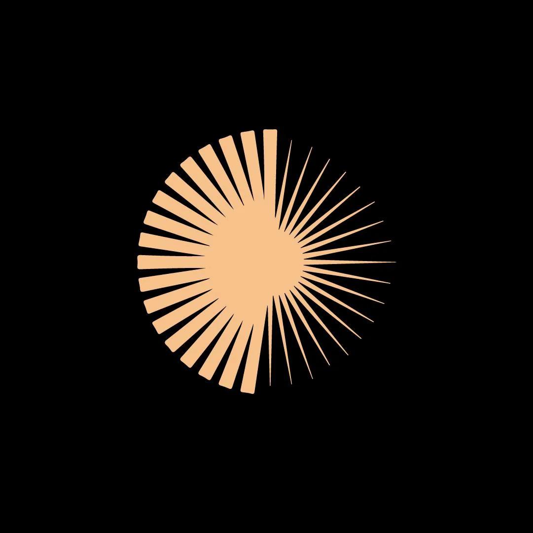 Stylized sunburst graphic on a black background