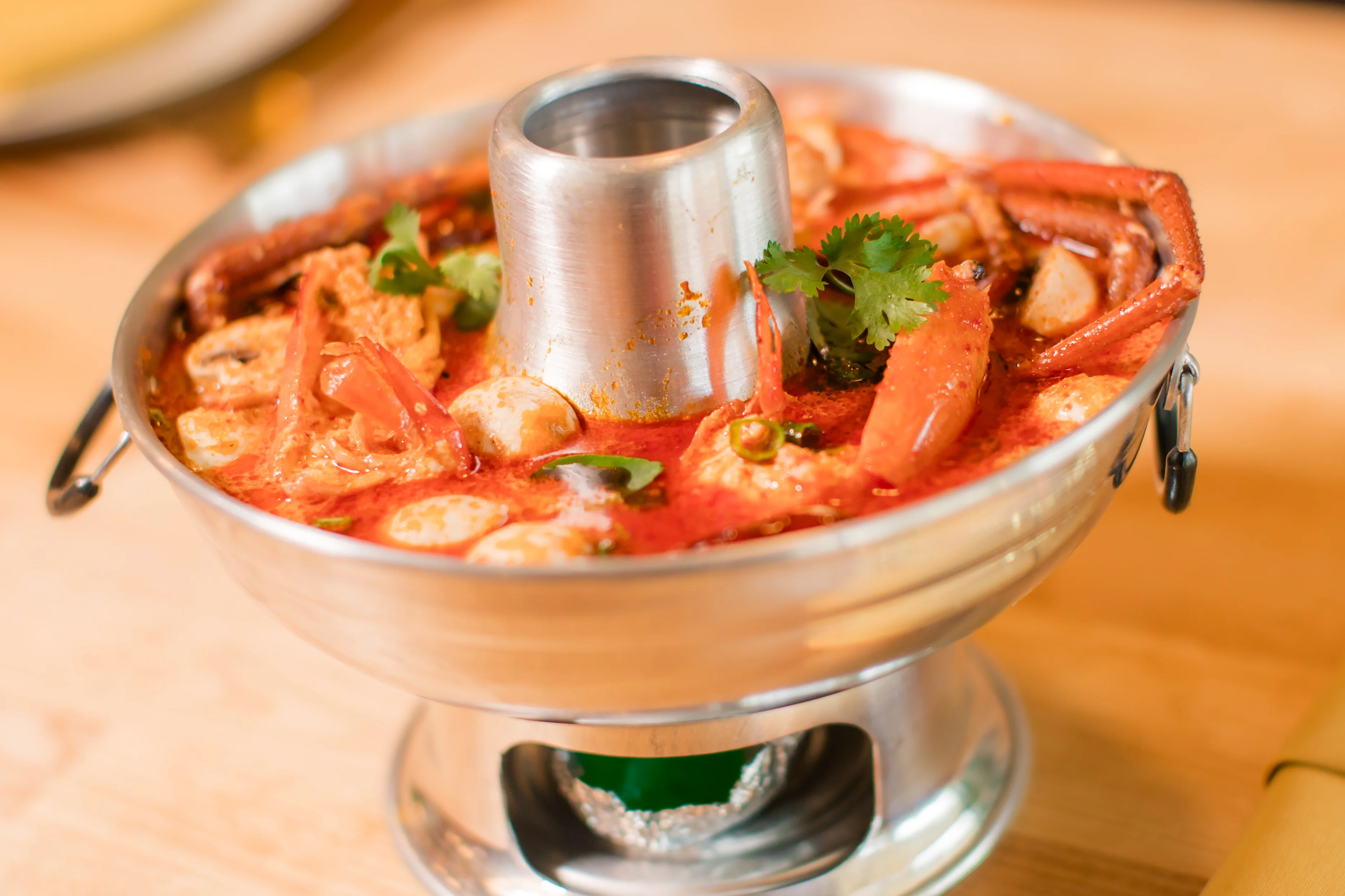 Spicy Thai seafood hot pot with fresh herbs