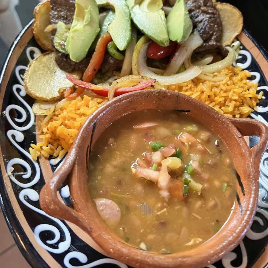 Mexican fajitas served with rice and beans