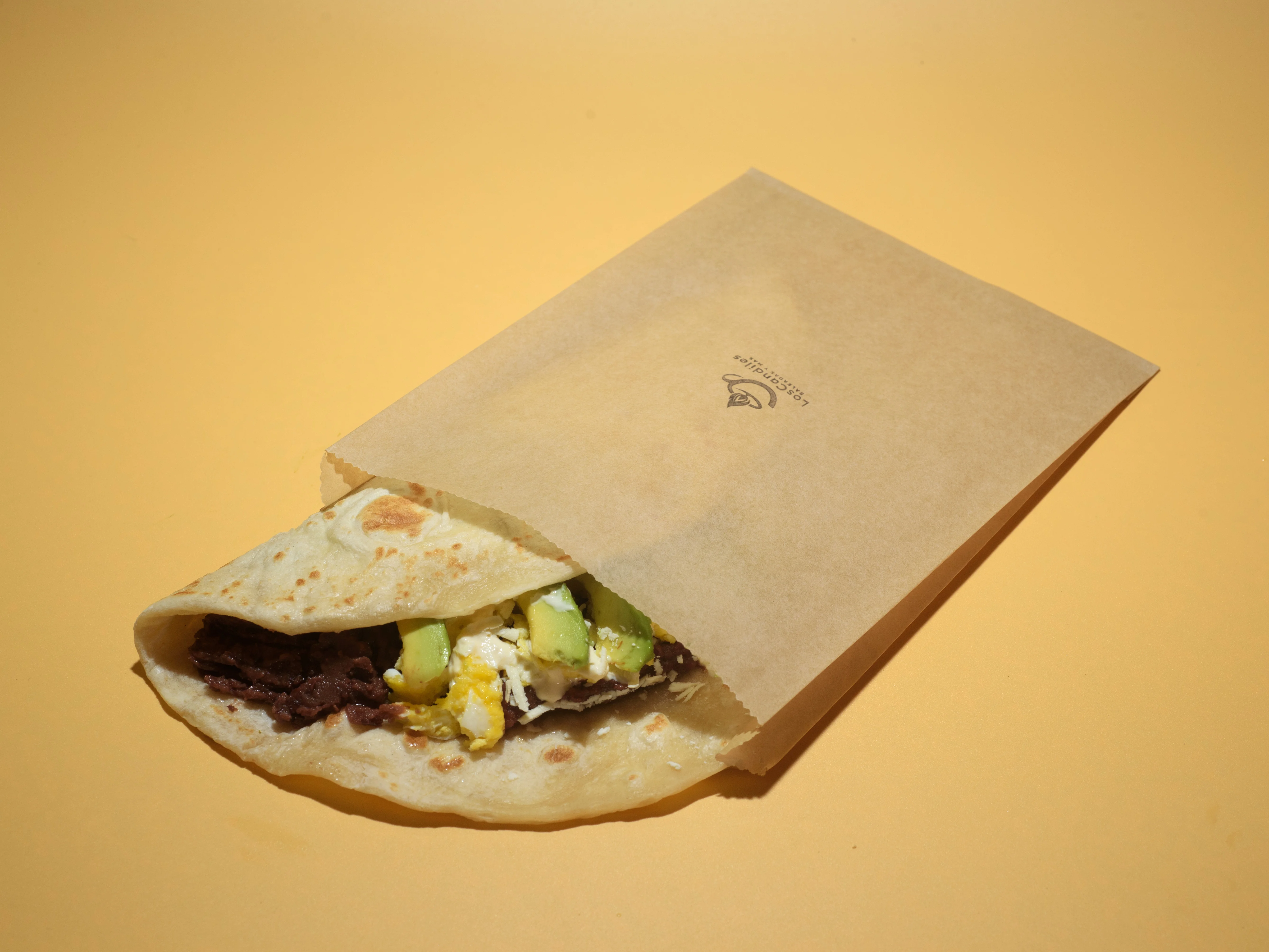 Delicious Mexican breakfast burrito wrapped in paper