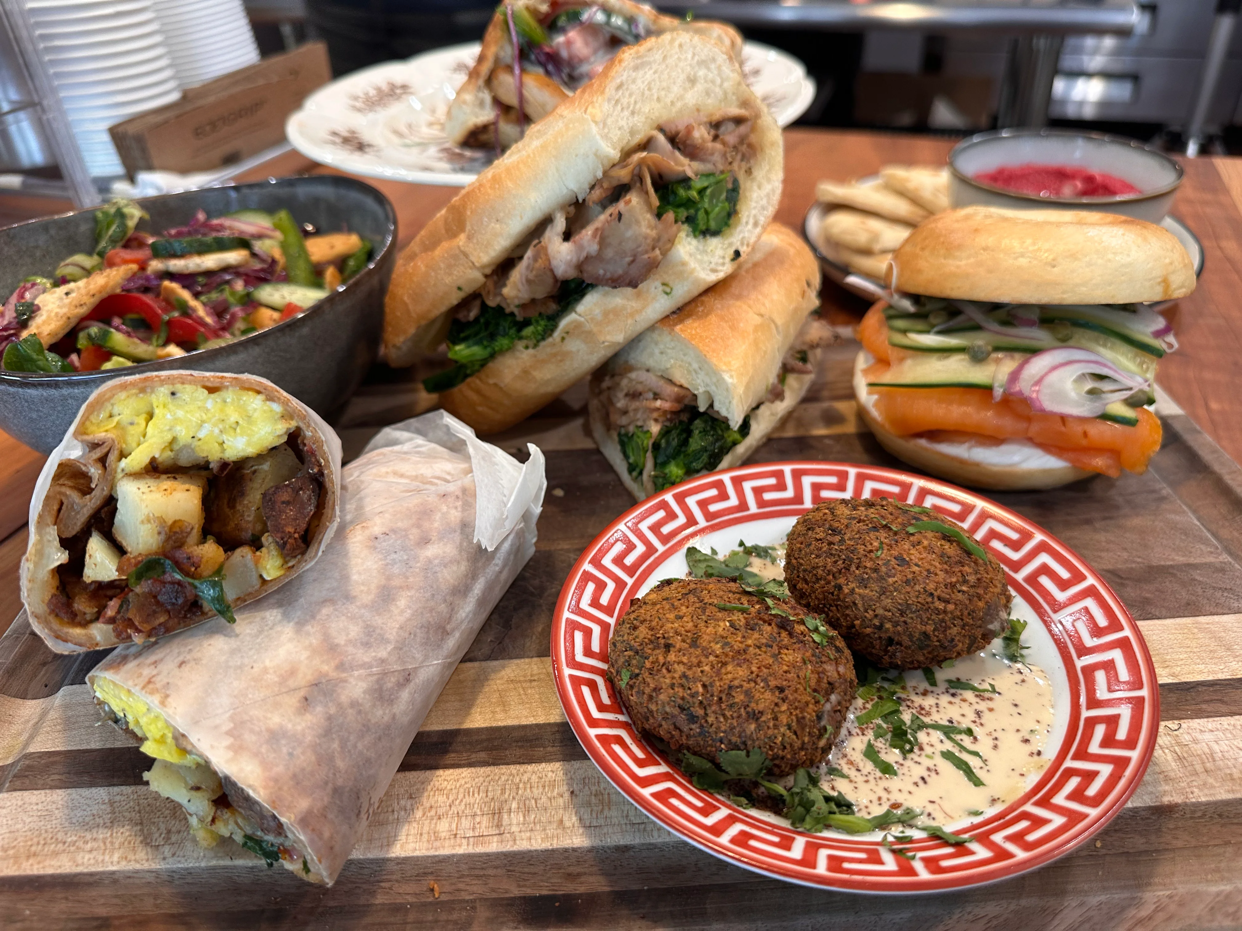 Assorted Mediterranean dishes including falafel and sandwiches