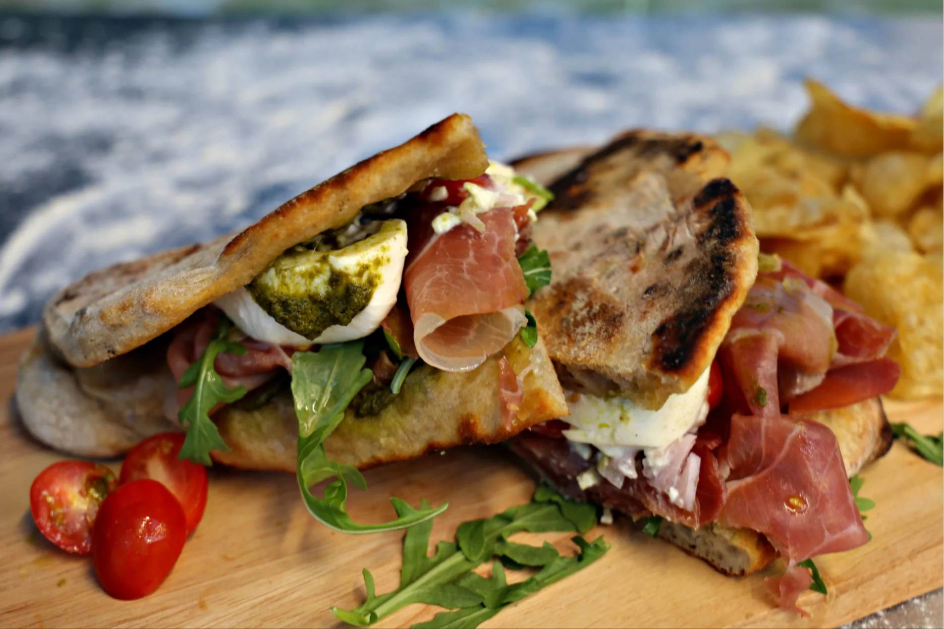 Italian focaccia sandwich with prosciutto and pesto
