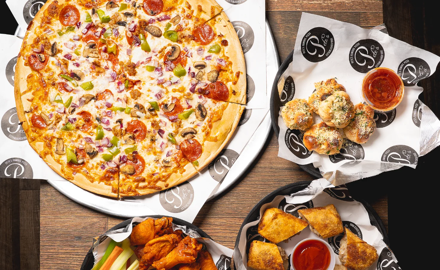 Delicious pepperoni and veggie pizzas with cheesesteaks in a cozy pizzeria