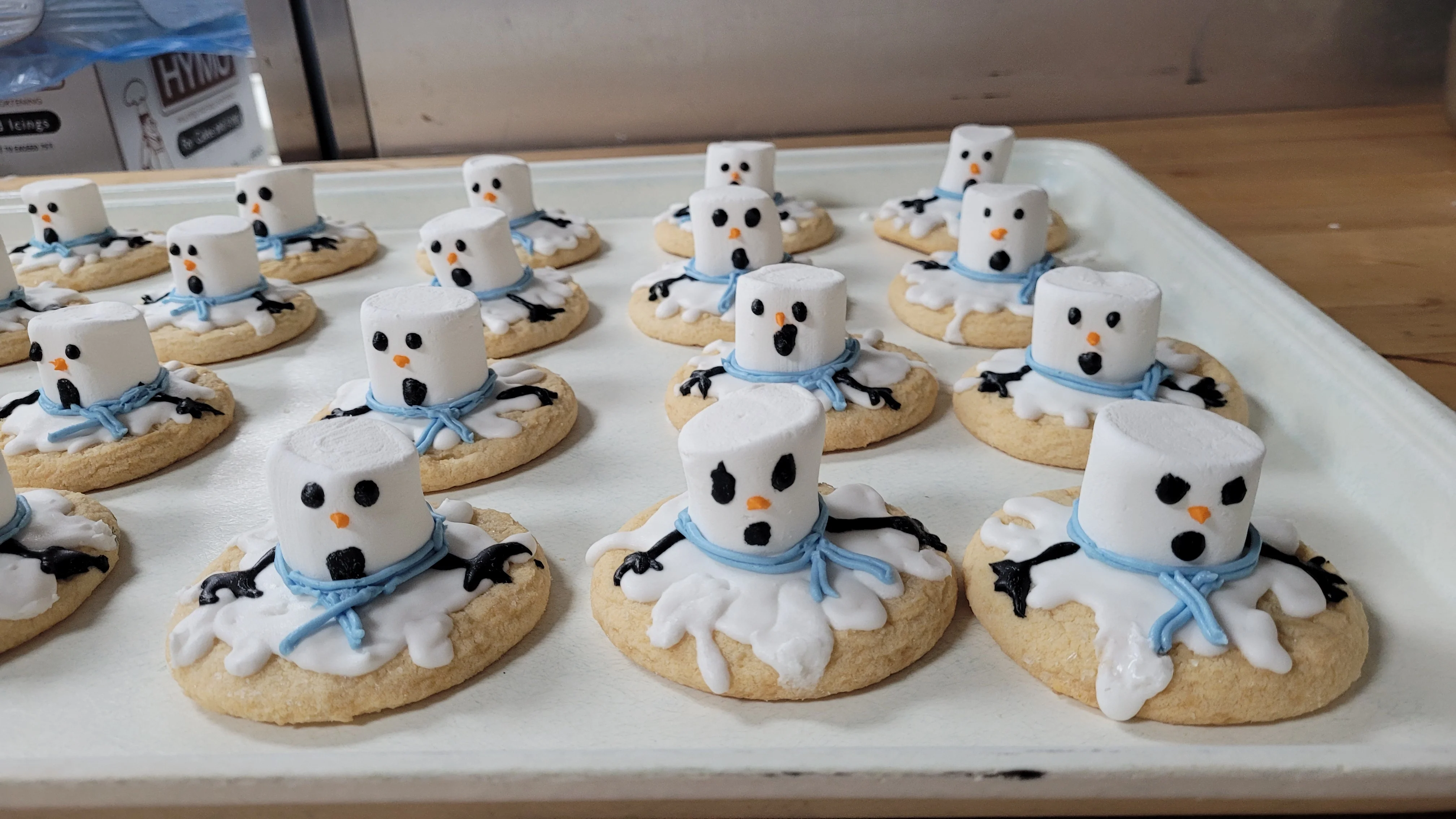 Festive snowman cookies with marshmallow and icing decorations