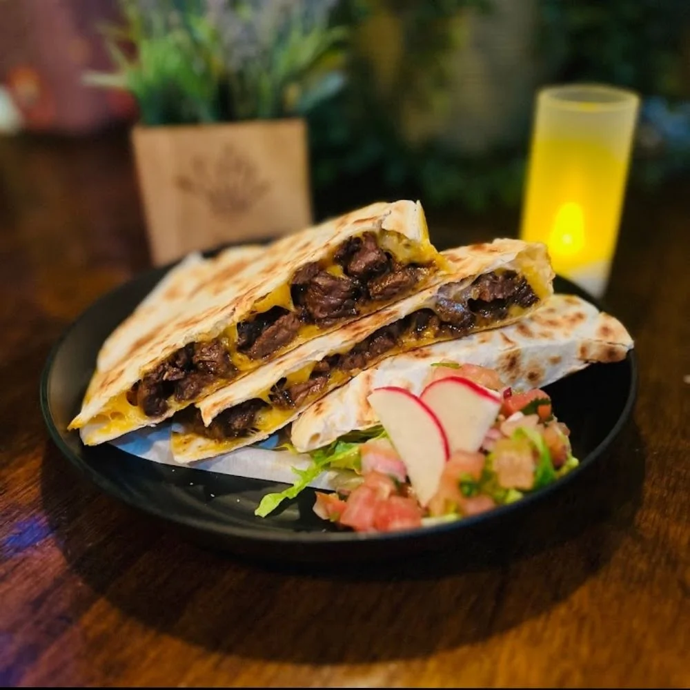 Delicious gourmet burger with fresh toppings on a wooden table