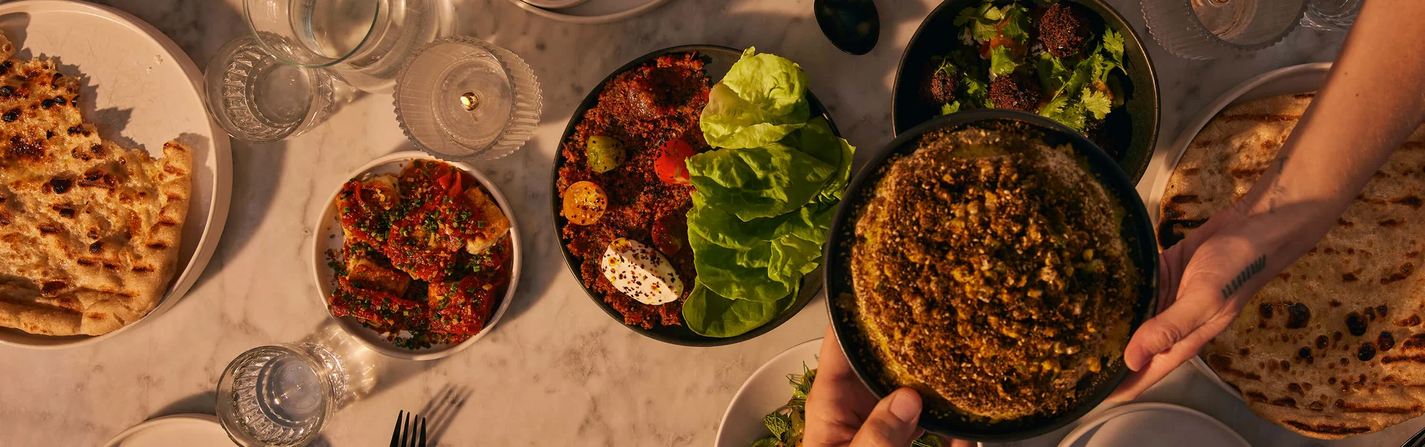 Mediterranean mezze platter with fresh salads and flatbreads