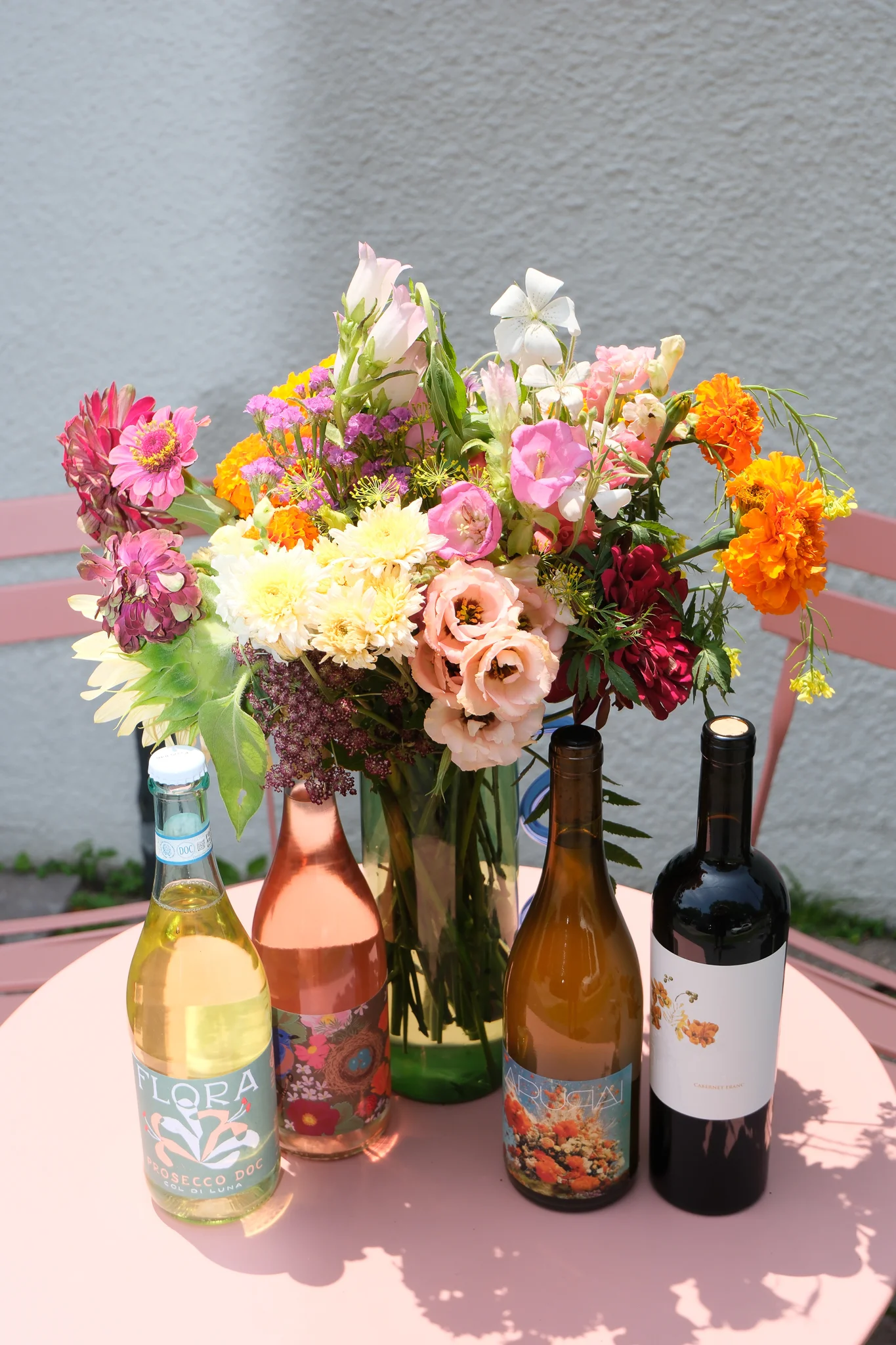 A beautifully arranged Mother's Day brunch table with flowers and elegant dishes.