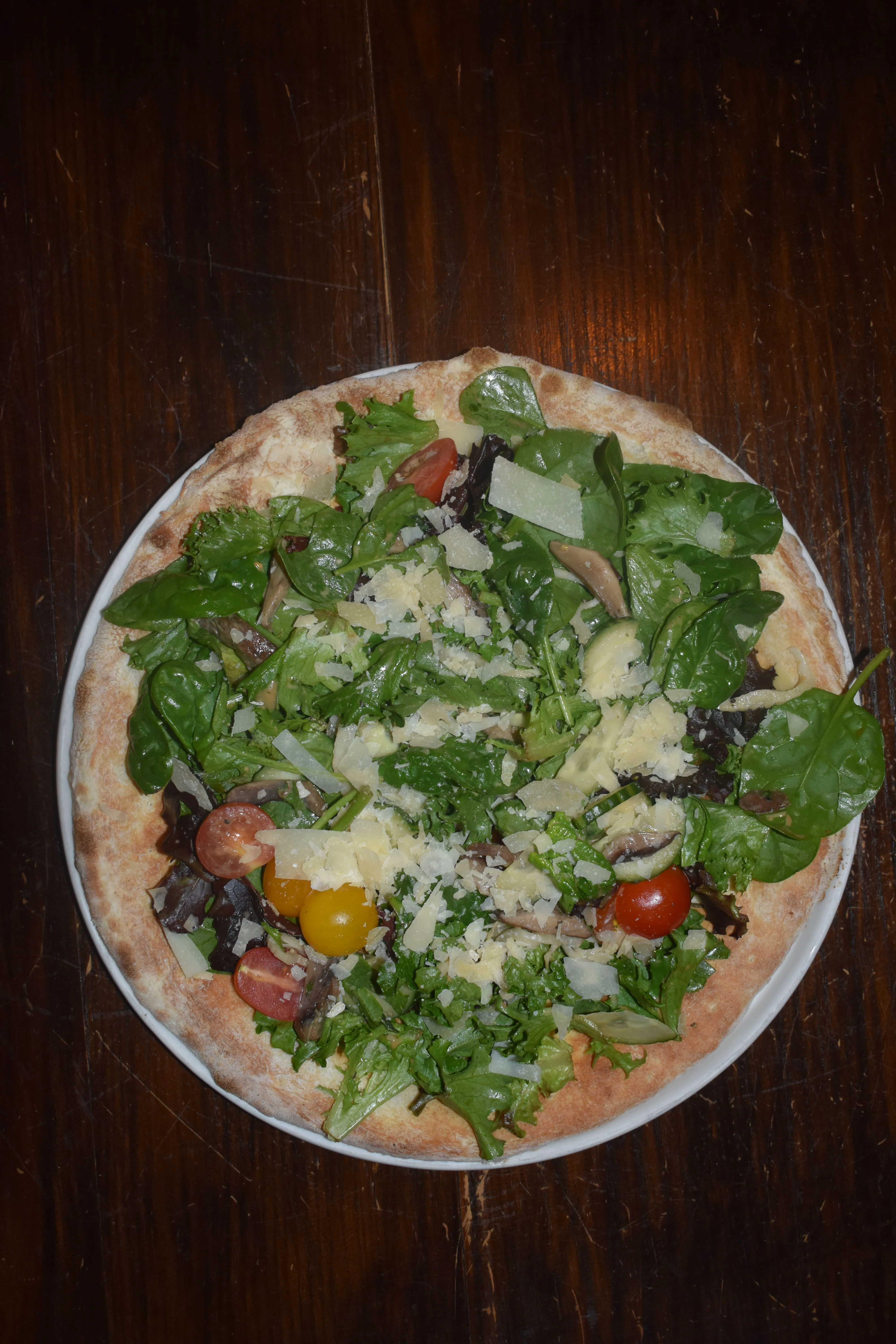 Fresh garden salad pizza with mixed greens