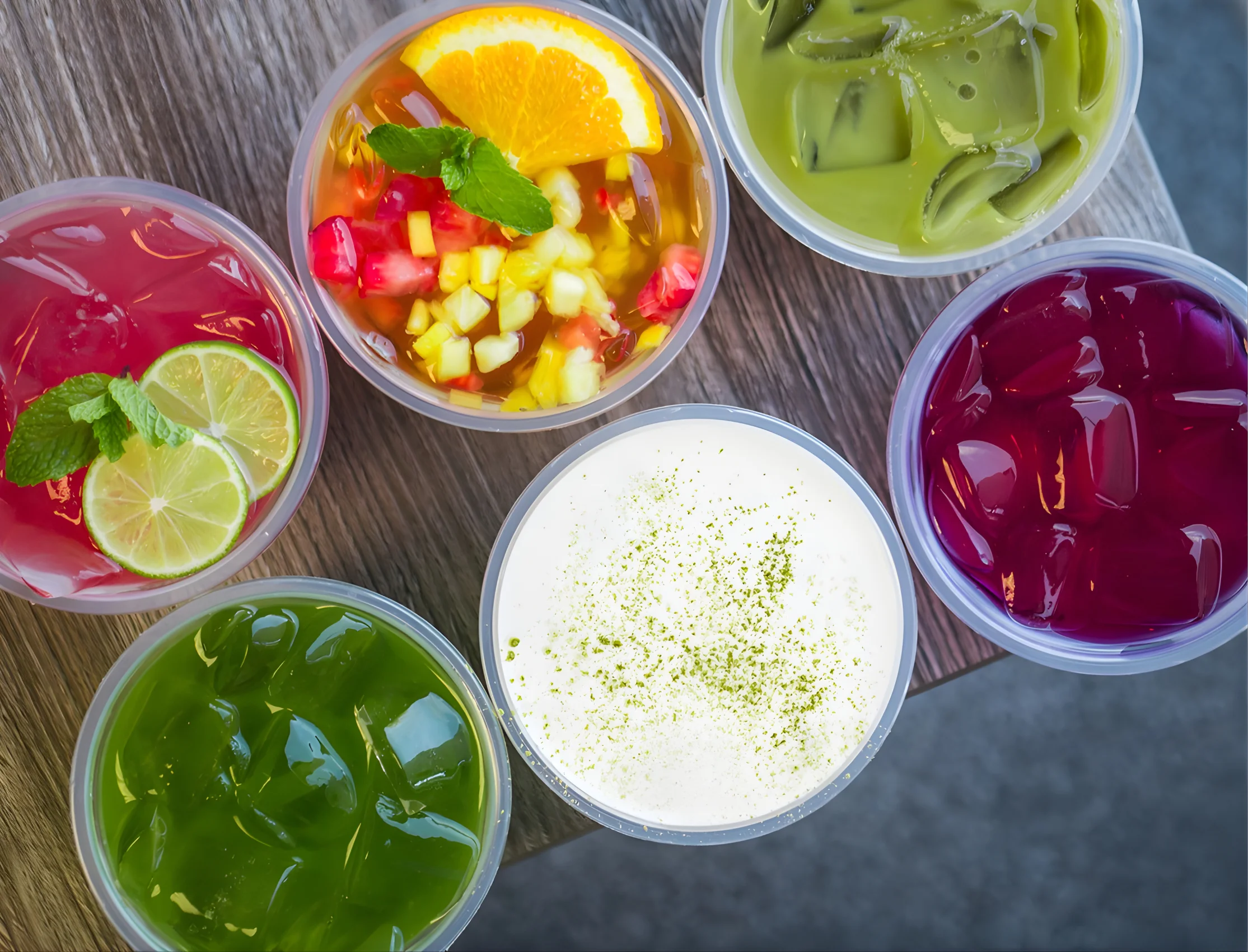 Colorful assortment of Asian jelly desserts in cups
