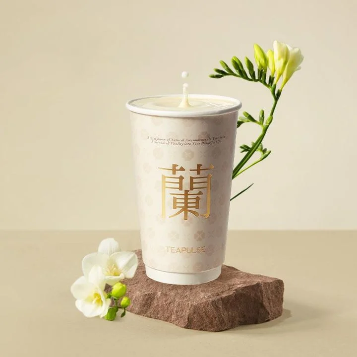 Artistic tea beverage in a decorative cup with floral accents