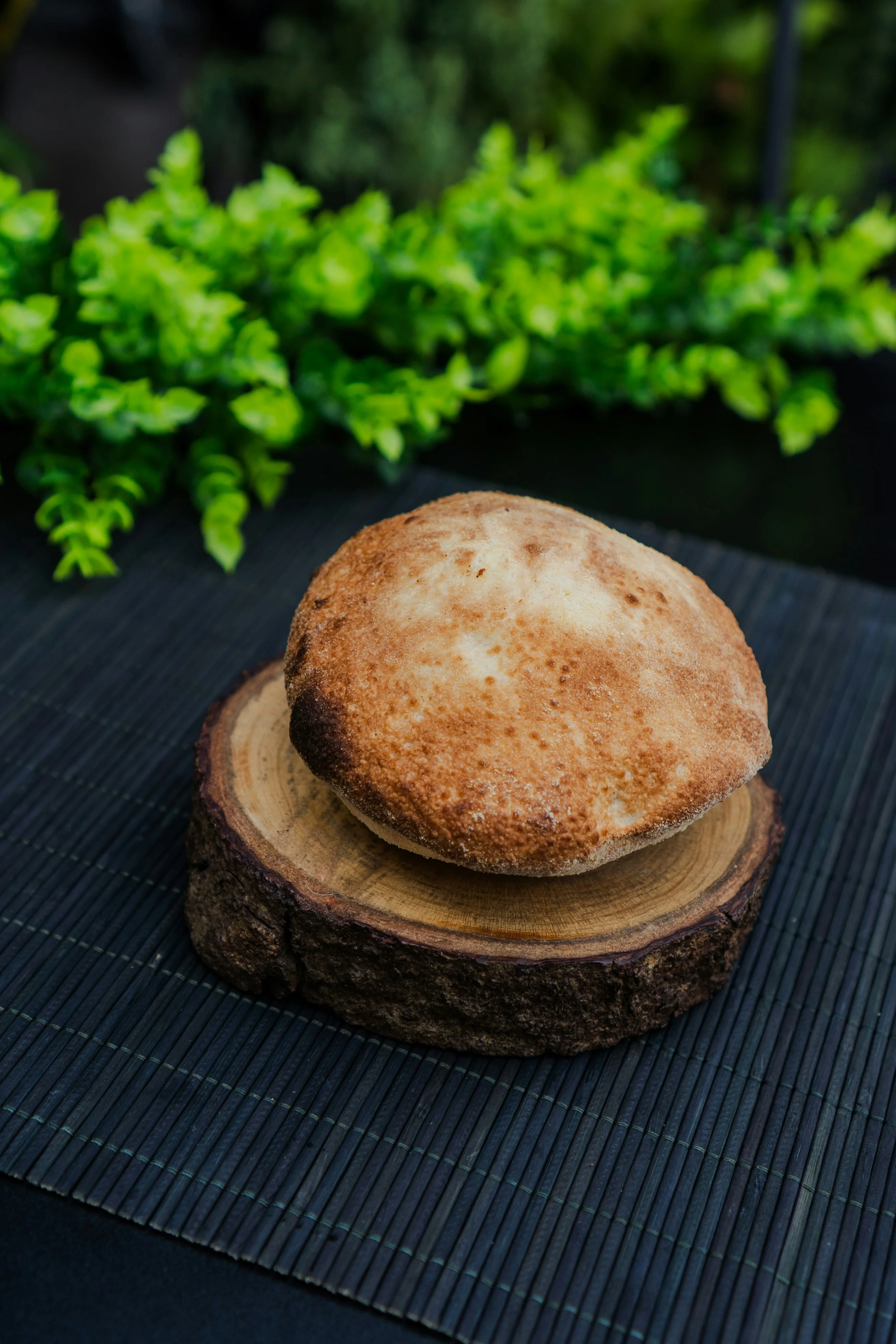 A round pita bread on a stove