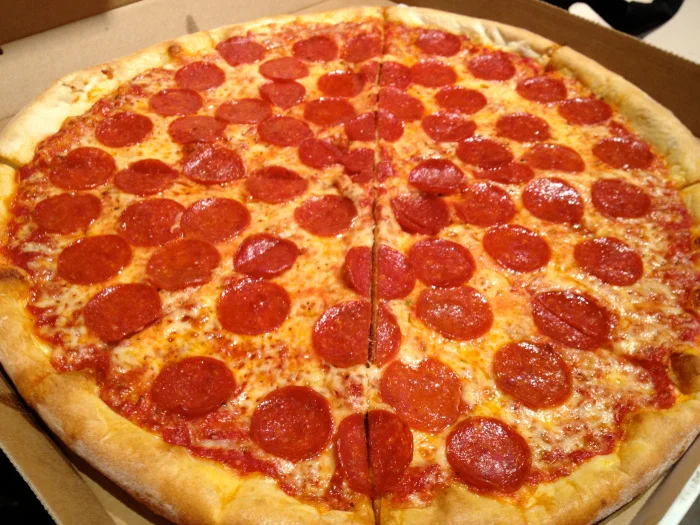 Classic pepperoni pizza in a cardboard box