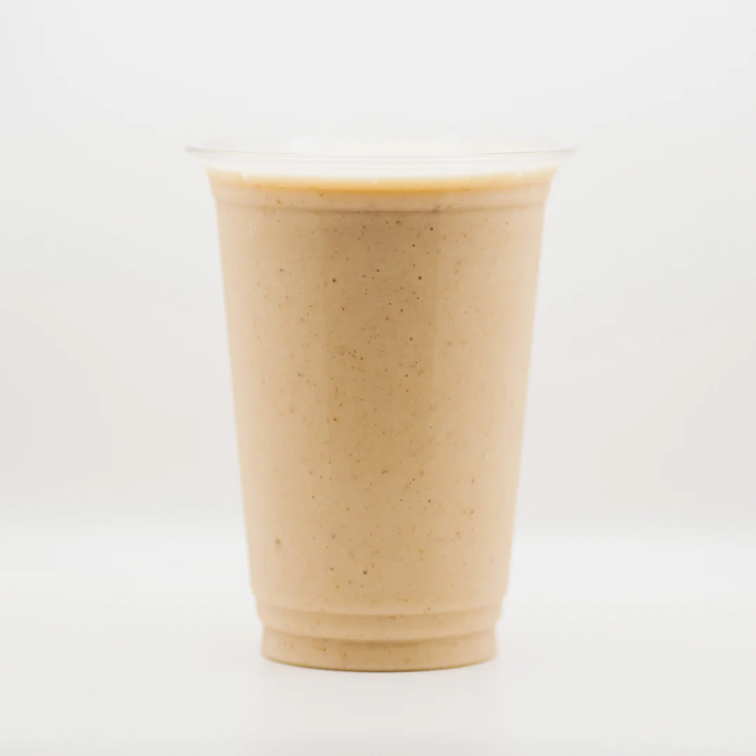 Creamy banana smoothie in a clear cup